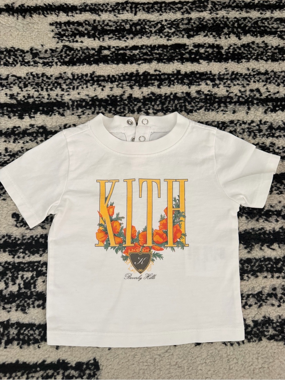 KITH White Short Sleeve Tee with Yellow & Orange Floral Logo